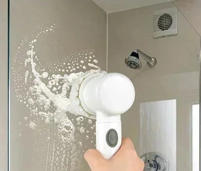 Spin scrubber cleaning a glass shower wall